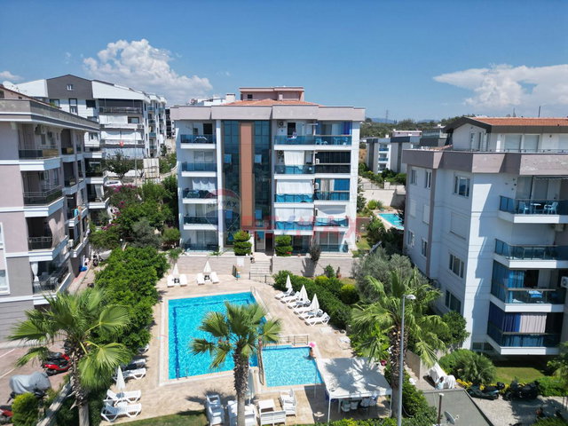 KUŞADASI HAVUZLU SİTE İÇİNDE DENİZ MANZARALI DOĞALGAZLI 2+1  DAİRE