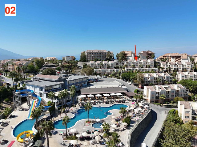 TÜM OLANAKLARI ILE BIR TATIL KÖYÜ IÇERISINDE SATILIK EŞYALI DUBLEKS DAIRE