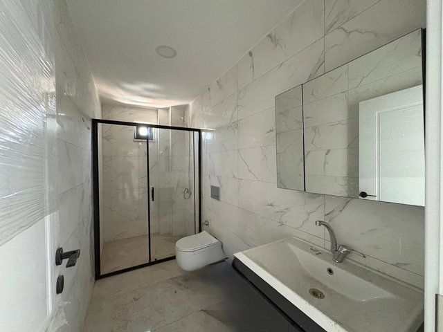 REMAX ADVANTAGEDE KURŞUNLUDA DENIZE YÜRÜME MESAFESINDE YATIRIMLIK DAIRE