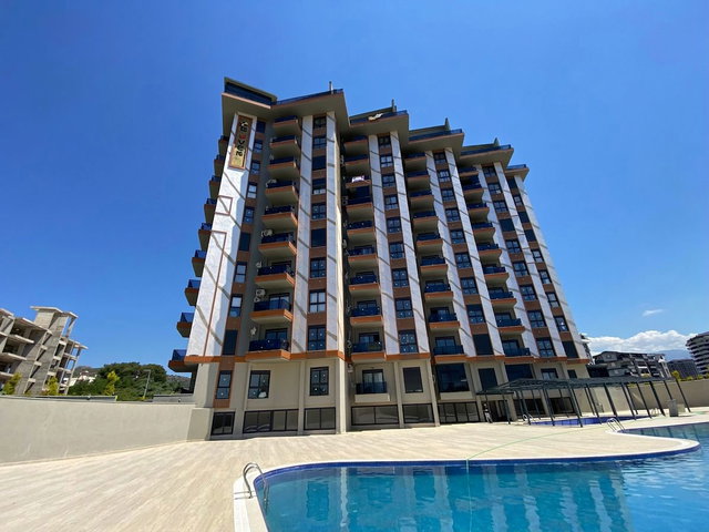 BOTANİK GARDEN SİTESİ'NDE HAVUZ VE TROPİK PARK MANZARALI 1+1