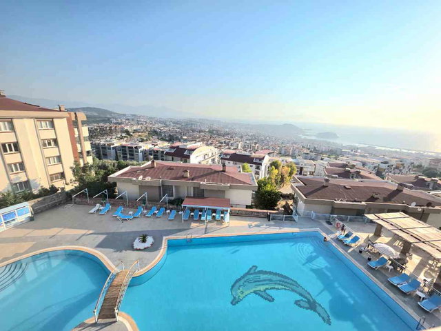 KUŞADASI EGE MAHALLESINDE KİRALIK 3+1 EŞYALI HAVUZLU FULL DENİZ MANZARALI DAIRE