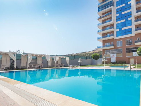 ÇIĞLI ŞANSLI EVLER SIT.SATILIK 1+1/BÜYÜK TIP/HAVUZLU