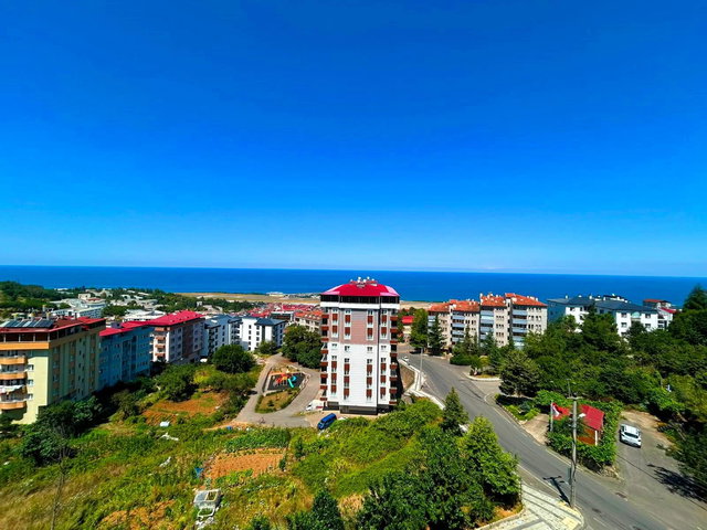 KANUNİ'DE ANAYOL ÜZERİ PANORAMİK DENİZ MANZARALI 2+1 SIFIR DAİRE