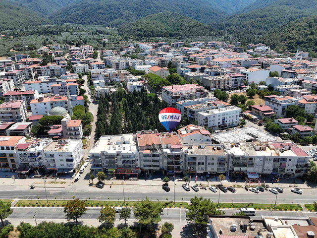 KUŞADASI GÜZELÇAMLI'DA SATILIK... BİR DAİRE İKİ DÜKKAN...