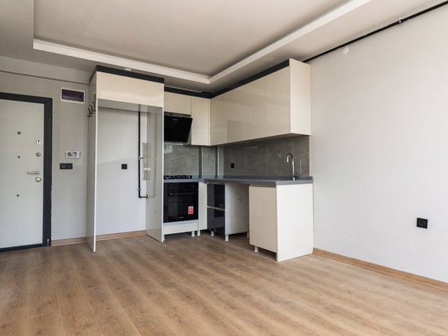 TAŞPINAR MAHALLESİNDE MERKEZİ KONUMDA SATILIK 1+1