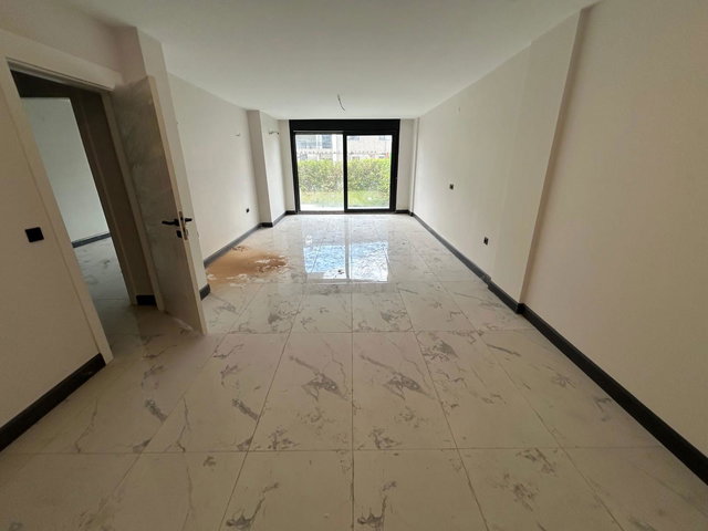 RE/MAX ŞEHİR'DEN HAVUZLU SİTEDE SATILIK BAHÇE DUBLEKS DAİRE