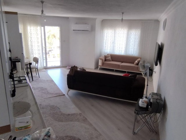 AYVALIK SARIMSAKLI’DA SATILIK | DENİZE YAKIN, YENİ TADİLATLI EŞYALI GENİŞ 1+1