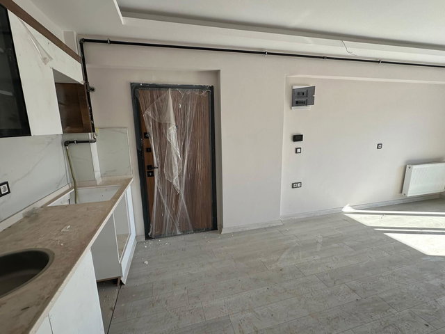 225 SEYREK MERKEZDE SIFIR BİNADA SATILIK 1+1 DAİRE