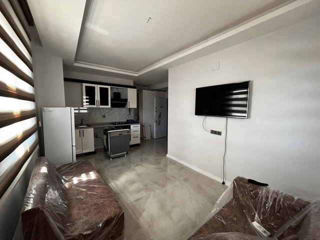 REMAX TOROS'TAN ÇİFTLİKKÖY'DE FULL SIFIR EŞYALI 2+1 BAHÇE KATI