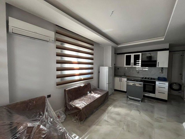 REMAX TOROS'TAN ÇİFTLİKKÖY'DE FULL SIFIR EŞYALI 2+1 BAHÇE KATI
