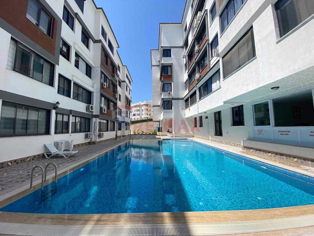 DİDİM HİSAR MAHALLESİ’NDE HAVUZLU SİTEDE 1+1 EŞYALI SATILIK DAİRE