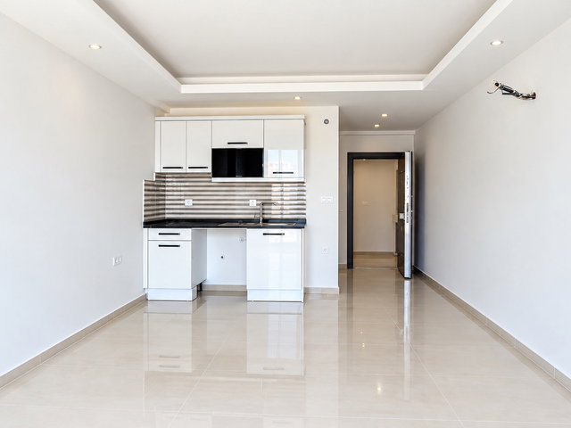ALANYA CİKCİLLİ CASPIAN RESIDENCE’DA KİRALIK 1+0  EŞYASIZ STÜDYO  DAİRE