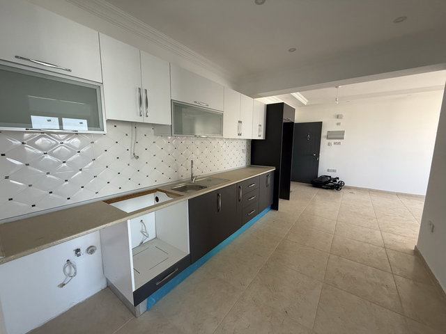 GIRNE ALSANCAK'TA OTURUMA HAZIR SIFIR SATILIK 2+1 DAIRE, DENIZ MANZARALI, SITE İÇERISINDE, BALKONLU