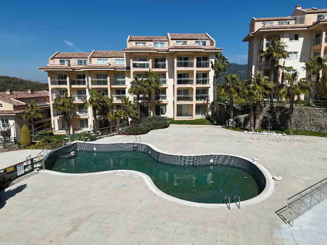 GOLF RESORT KUŞADASI SATILIK DENİZ MANZARALI 2+1 EŞYALI DAİRE