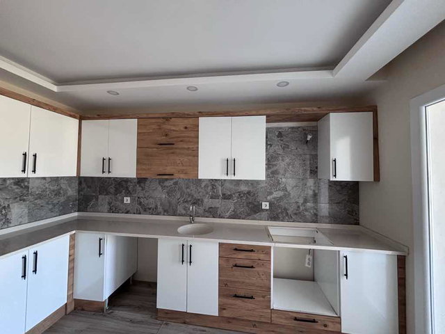 KUŞADASI UYDUKENT’TE DENİZ MANZARALI FULL TADİLATLI 2+1 DAİRE