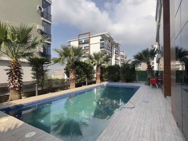 İZMİR’DE AÇIK HAVUZLU REZİDANS’TAGENİŞ 1+1  SATILIK DAİRE