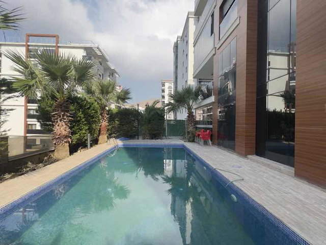 İZMİR’DE AÇIK HAVUZLU REZİDANS’TAGENİŞ 1+1  SATILIK DAİRE