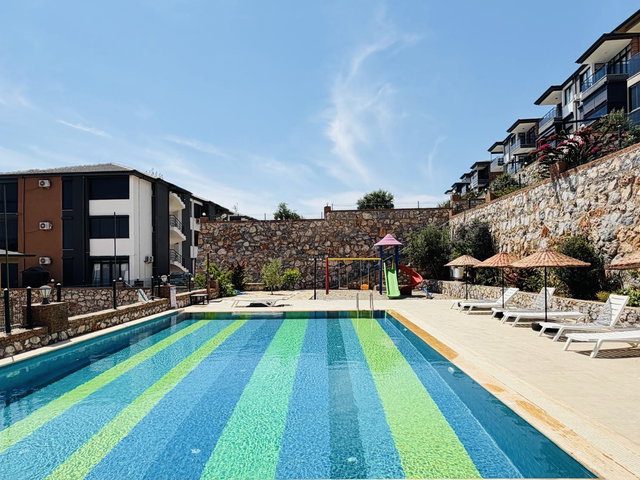DİDİM’DE HAVUZLU SİTEDE 2+1 EŞYALI, ÇİFT  BALKONLU DENİZ MANZARALI DAİRE